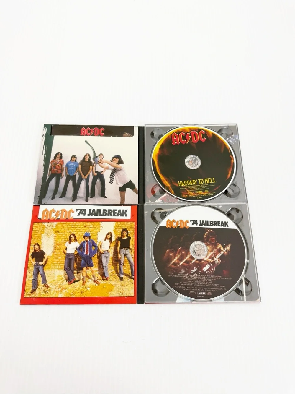 Set of 2 2003 AC/DC Remastered Music CDs Epic Jailbreak Highway to Hell
